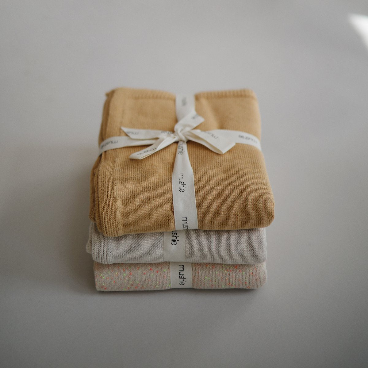 Mushie | Knitted Textured Dots Baby Blanket - Mustard Melange